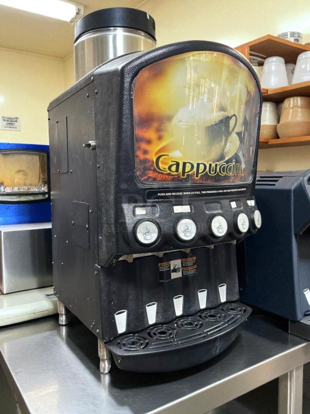 Grindmaster PIC5 dispenser for five powdered beverages. Features buttons, cup graphics, and Cappuccino label. Tested working.