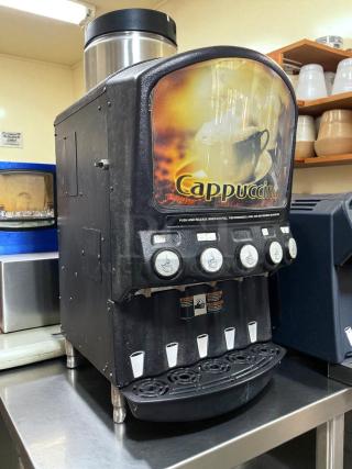 Grindmaster PIC5 dispenser for five powdered beverages. Features buttons, cup graphics, and Cappuccino label. Tested working.
