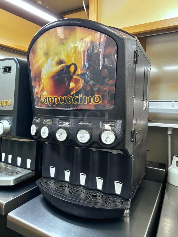 Grindmaster PIC5 beverage dispenser in working condition, offers five flavors, features cappuccino label and button controls.