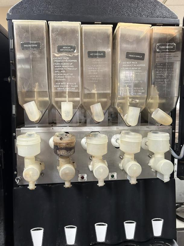 Grindmaster PIC5 beverage dispenser with five flavor compartments, labeled for specialty drinks. Tested and working condition.