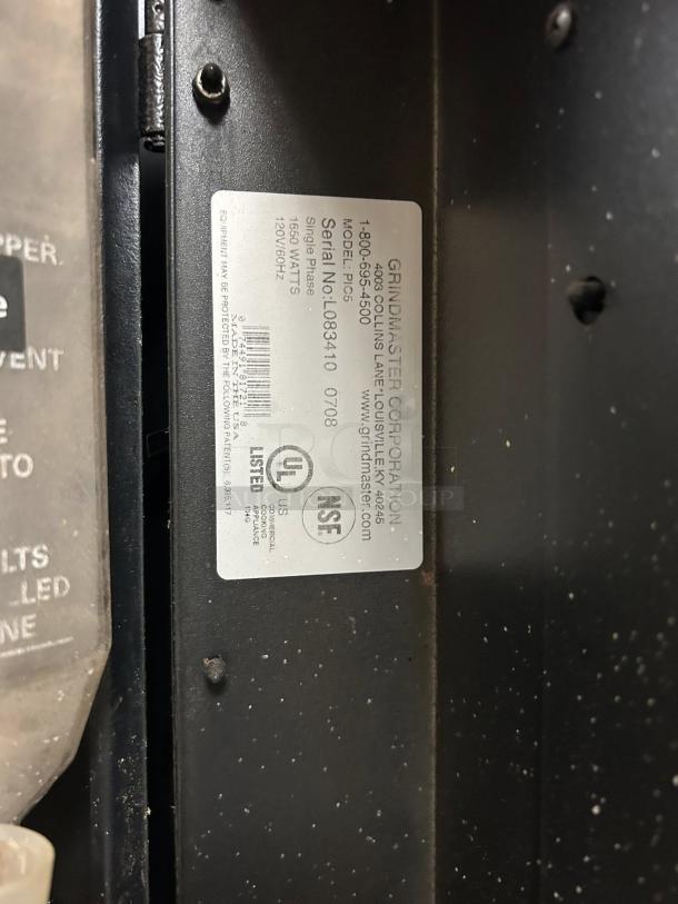 Grindmaster PIC5 beverage dispenser with label showing model, serial number, and power specifications; tested and working condition.