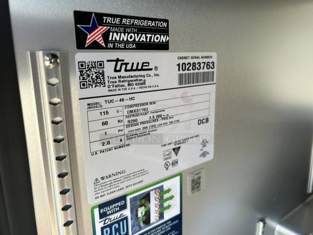 True TUC-48-C-HC 48" stainless steel undercounter refrigerator label showing model, serial number, and specs. Like new.