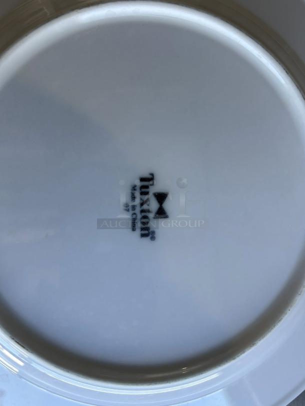 Tuxton 10 1/2” white dining plate, excellent condition, visible logo. Made in China.