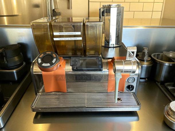 Thermoplan Mastrena II espresso machine, 220v, 3ph, tested and working, visible control panel, cup holders, stainless steel finish.