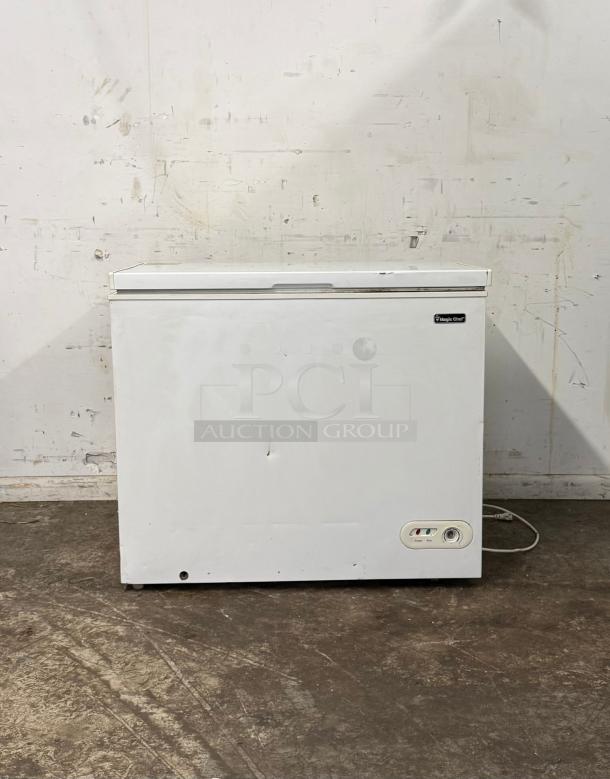White Magic Chef deep freezer, lightly used, visible minor dent on front, control panel with dial, plug attached.