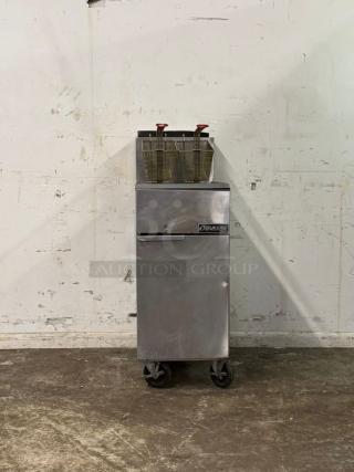 Dukers DCF4-NG 50 lb. Natural Gas Commercial Floor Fryer with 120,000 BTU, stainless steel, dual baskets, on casters, in good condition.