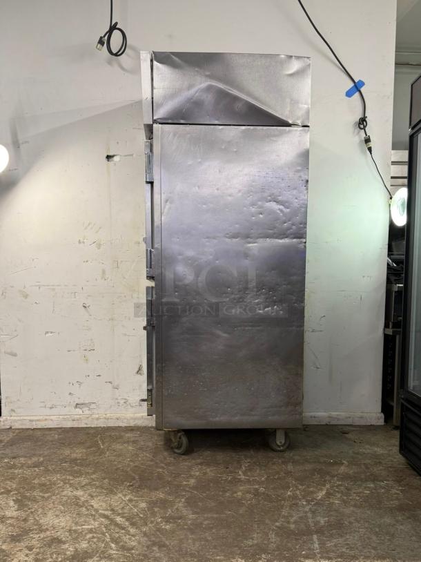VICTORY Dual Temp Refrigerator/Freezer, Model RFS 1D S7 HD, stainless steel, visible dents, on casters, industrial use.