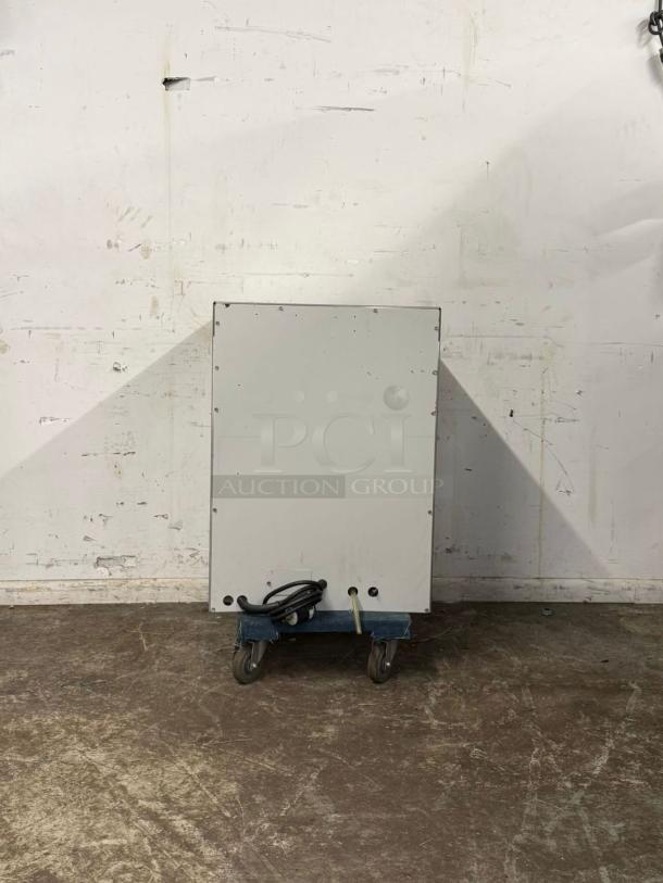 Labconco under-counter dishwasher on wheels, white finish, visible rear panel, in used condition.