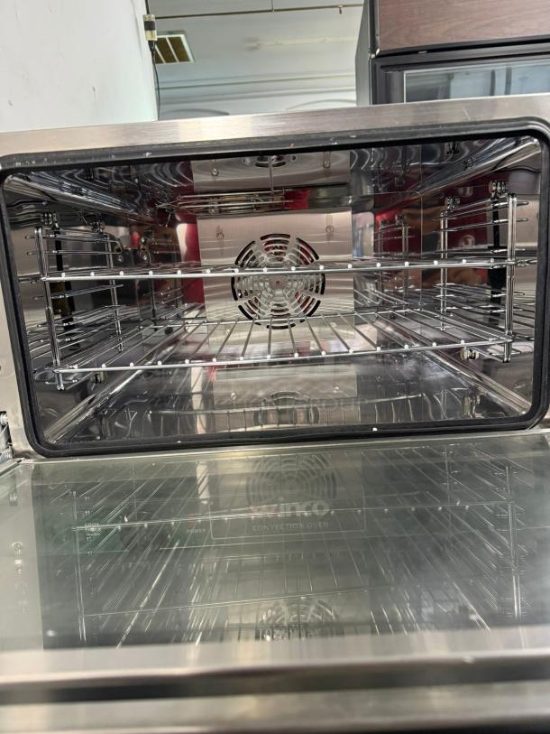 WINCO half-size countertop convection oven, stainless steel interior, visible racks, excellent condition, 120v power.