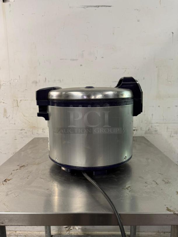 Thunder Group SEJ3201 30 Cup Electric Rice Cooker-Warmer, stainless steel exterior, visible power cord, used condition.