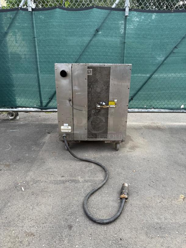OLIVER 690-NC2 stainless steel commercial electric unit, used condition. Visible power cable. Ideal for industrial settings.