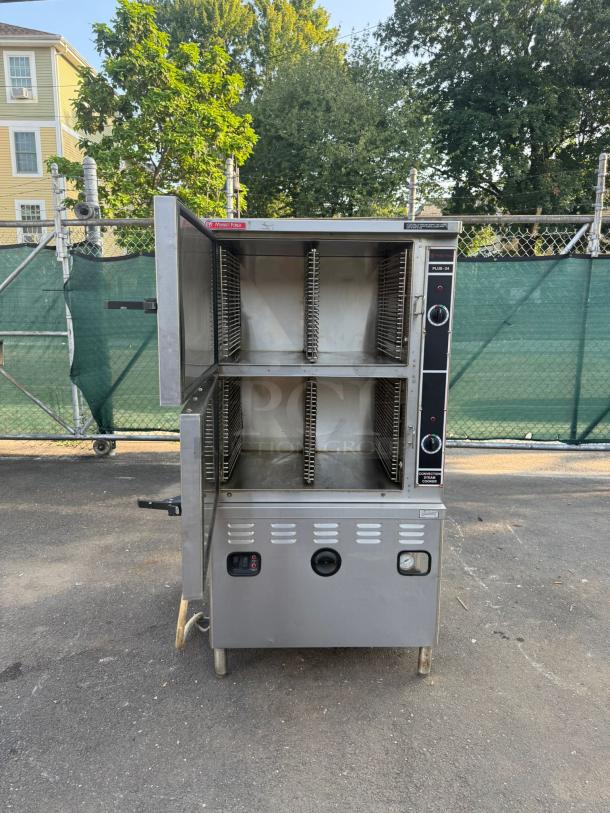 Market Forge ST-24M36G 24-pan freestanding convection steamer, 36" boiler, model ST-24, open door, outside view.