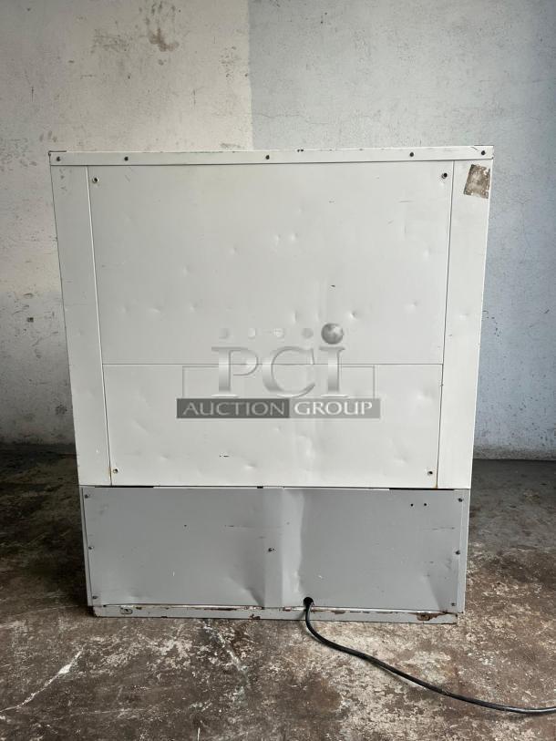 Grab & Go Open Top Display Cooler in steel/white. Tested and working, shows wear and scratches. Cable visible at base.