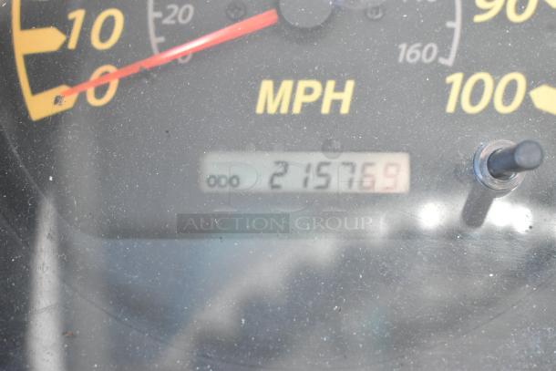 Close-up of speedometer showing odometer reading 215,769 miles for 2004 Isuzu Morgan Diesel Reefer Box Truck.