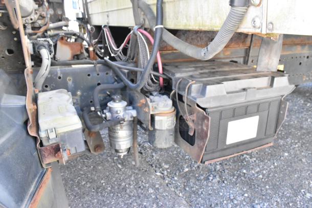 2004 Izuzu Morgan diesel reefer truck chassis showing Carrier Transicold system and wiring, condition reflects wear.
