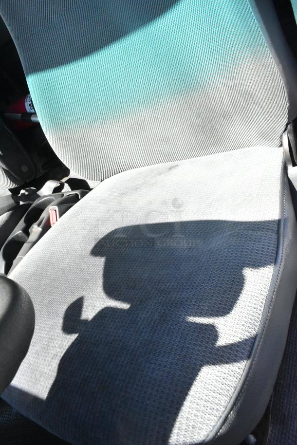 2004 Izuzu Morgan Diesel Reefer Box Truck interior seat, showing fabric condition. Odometer reads 215,769 miles.