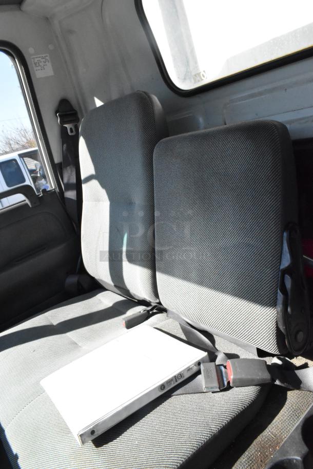 2004 Izuzu Morgan Diesel Reefer Box Truck interior, showing gray fabric seats and safety belts. Odometer: 215,769 miles.