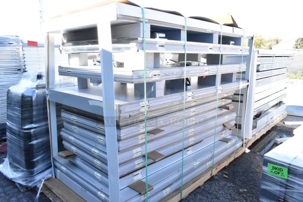 Brand new Amerikooler 8x16x7'7" walk-in freezer/cooler parts, stacked on pallets. Top-mounted refrigeration included.
