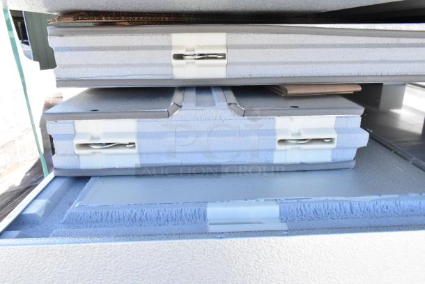 Brand new Amerikooler DW081677F-8/8-SC walk-in cooler/freezer panels, showing interlocking edges; 8' x 16' x 7'7".
