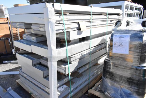 Amerikooler 8' x 16' x 7' 7" walk-in freezer/cooler parts on pallets, new scratch and dent, top-mounted refrigeration label visible.