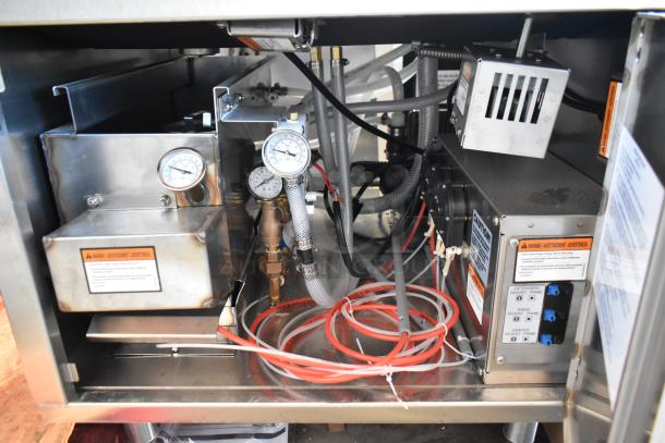 Noble Wareforce CG-115 stainless steel underbar glass washer. Features gauges, valves, and wiring. Clean condition, 115V, 1 Phase.