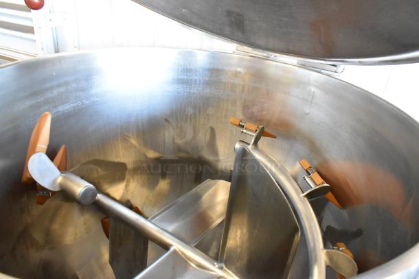 Pardo & Sons stainless steel commercial steam kettle with agitator, floor style. Clean interior, visible paddles, lid partially open.