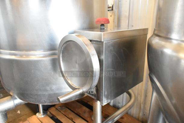 Cleveland KDL-60T stainless steel 60-gallon manual tilt steam kettle in good condition; features red valve handle.