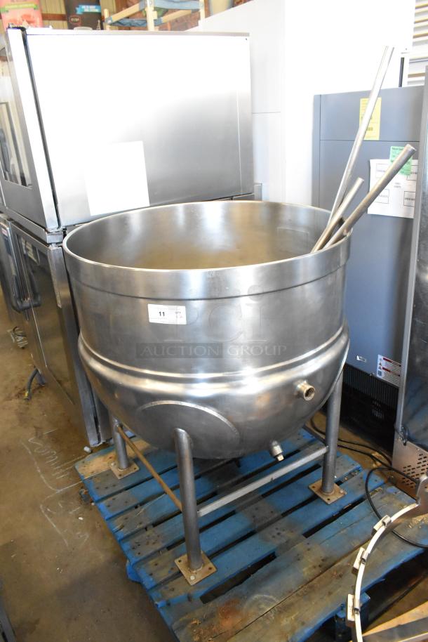 Stainless steel commercial floor-style kettle with agitator, showing welded design and mounted on sturdy legs.