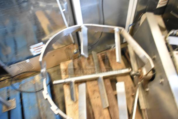 Stainless steel commercial floor style kettle with agitator, shown on a pallet. Slightly worn, suitable for industrial use.