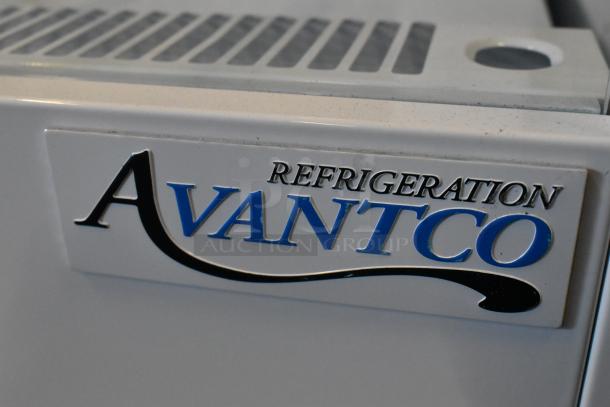 Brand new Avantco 193VOA70W white metal commercial merchandiser, extra deep, with LED lighting and commercial casters.