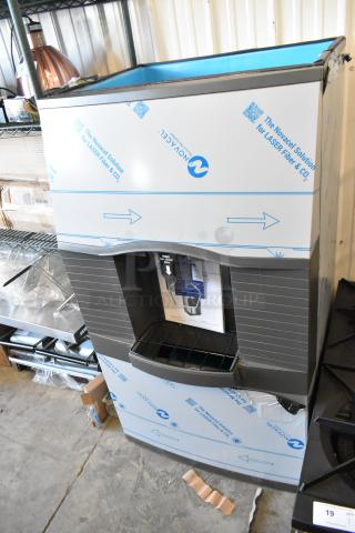 Brand new Manitowoc SPA312-161 stainless steel 30" touchless hotel ice dispenser. Minor scratches and dents visible.