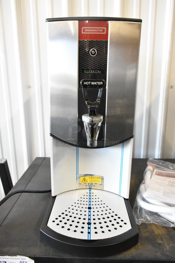 Brand new Grindmaster 1000660GM hot water dispenser, 5.3 gal, tap-operated, 240V, 1 phase, minor scratches.