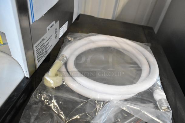 Grindmaster 1000660GM hot water dispenser, 5.3-gallon, tap-operated, 240V, QC passed label, coiled hose included.