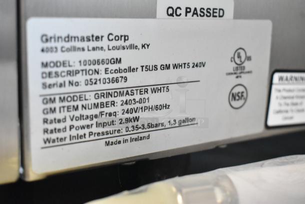 Brand new Grindmaster 1000660GM hot water dispenser, tap-operated, 5.3 gal, 240V, QC passed label, NSF-certified.