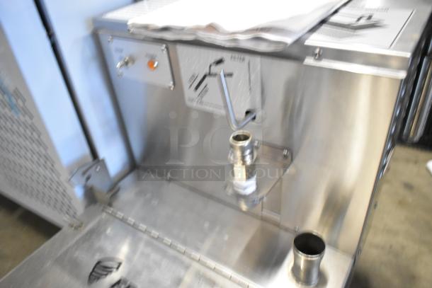 Brand new Fryclone 259OFM85 fryer oil filter machine, stainless steel, with 2-way pump, 85 lb. capacity, slight dents visible.