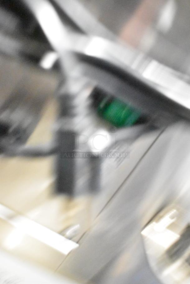 The image is blurred and does not provide clear details of the Fryclone 259OFM85 fryer oil filter machine.
