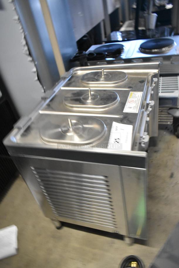Crathco stainless steel refrigerated drink dispenser base, model CS-3L-16-290, new with scratches and dents, no hoppers.