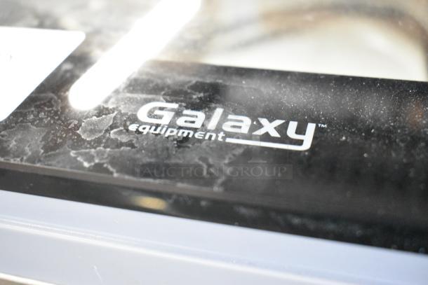 Stainless steel Galaxy 177GVMC12P vacuum packaging machine, brand logo visible. Features 12" seal bar, dry pump. 120V, 1 Phase.