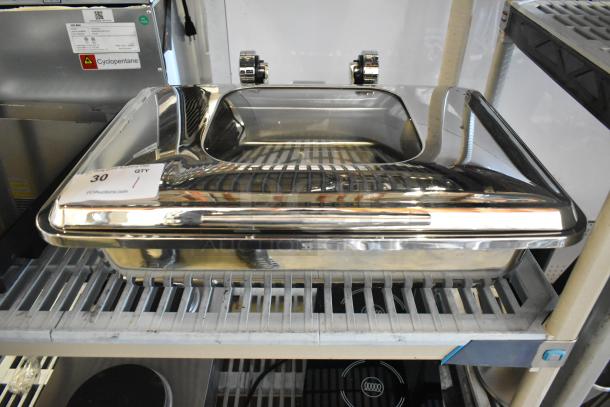 Stainless steel chafer, brand new with minor scratches and dents, shown on shelf. Auction tag visible, labeled "30 QTY."