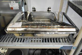 Stainless steel chafer, brand new with minor scratches and dents, shown on shelf. Auction tag visible, labeled "30 QTY."