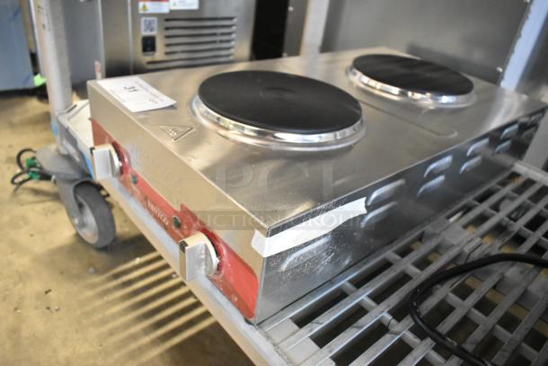 Brand new Avantco 177EB202F2BM double burner solid top stainless steel electric hot plate, visible minor dents.
