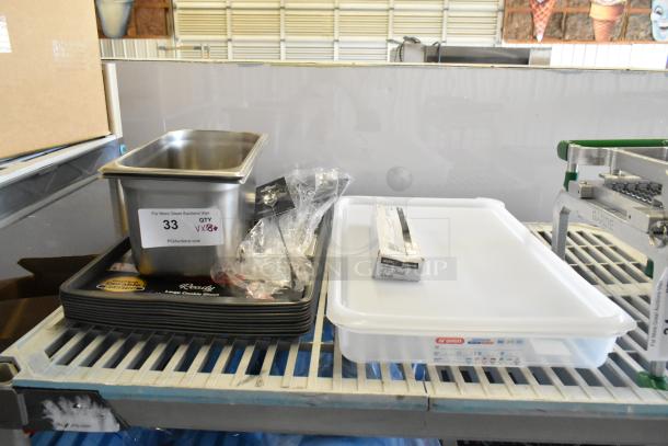 Assorted kitchen items including Barfly bar spoon, stainless steel pan, Acopa steak knife box, and baking sheets on display.