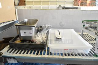 Assorted kitchen items including Barfly bar spoon, stainless steel pan, Acopa steak knife box, and baking sheets on display.