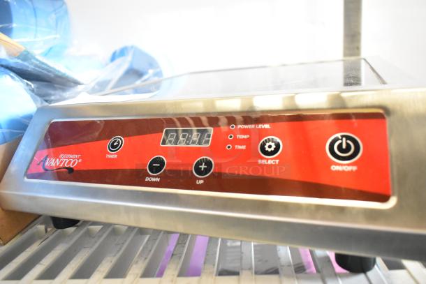 Brand new Avantco 177IC3500 countertop induction range, 208-240V, with digital controls and minor cosmetic scratches.