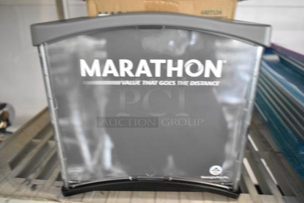 BRAND NEW Marathon 6407124 Interfold Napkin Dispenser, scratch and dent condition, black with branding visible.