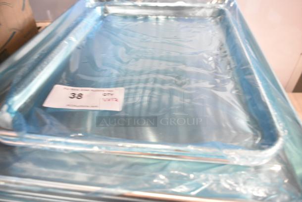 12 new scratch and dent items, including Choice cutting board and sheet pans. Tag: auction lot 38.