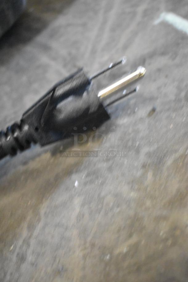 Power cord of the Blendtec CB1 Chef Blender, showing a plug. Blender is brand new with minor scratches.