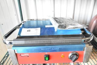 Brand new Avantco 177PG200GS panini grill, grooved top, smooth bottom, 13 3/8" x 8 3/4" surface, 120V, scratch and dent condition.