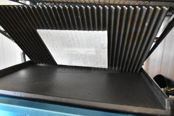 BRAND NEW Avantco 177PG200GS Panini Grill, grooved top, smooth bottom, 13 3/8"x8 3/4" surface, 120V, 1 Phase.