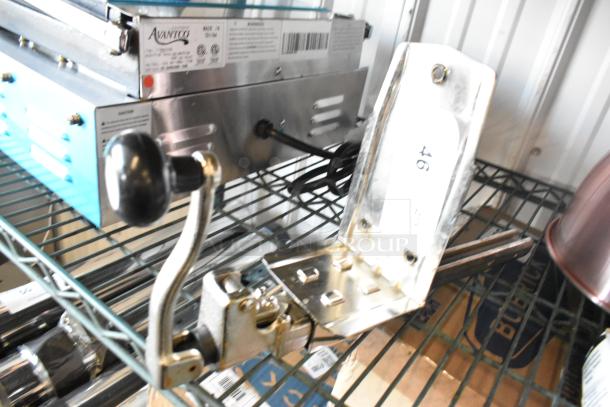 Brand new Choice light duty manual can opener with base plate, silver, ideal for standard duty use. Slight scratches visible.